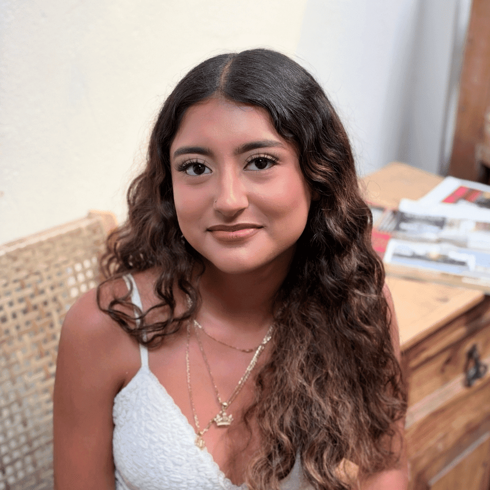 Portrait of Yasmin Ramirez, a professional stylist at Salon Bamboo, showcasing their expertise and style.